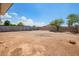 Large backyard with gravel and block fencing, offering privacy at 122 N 5Th St, Avondale, AZ 85323