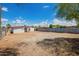 A spacious backyard with a chain-link fence, offering privacy and security for outdoor activities and potential landscaping at 122 N 5Th St, Avondale, AZ 85323