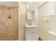 Cozy bathroom featuring neutral tile in the shower, a toilet, and a vanity with storage at 122 N 5Th St, Avondale, AZ 85323