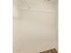 Empty walk-in closet featuring wood-look flooring, and painted white at 122 N 5Th St, Avondale, AZ 85323