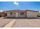 Charming single-story home with a gravel yard, offering a clean, low-maintenance landscape at 122 N 5Th St, Avondale, AZ 85323