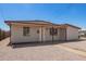 Quaint single-story home featuring desert landscaping for a low-maintenance front yard at 122 N 5Th St, Avondale, AZ 85323