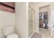 Bathroom features shower with glass doors and walk-in closet access at 1350 S Greenfield Rd # 1123, Mesa, AZ 85206
