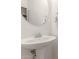 Powder room features pedestal sink, decorative mirror, and towel bar at 1350 S Greenfield Rd # 1123, Mesa, AZ 85206