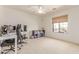 Bedroom showcasing a ceiling fan, neutral walls, and a view to the outside at 1350 S Greenfield Rd # 1123, Mesa, AZ 85206