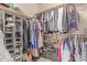 Spacious walk-in closet with ample shelving and hanging space at 1350 S Greenfield Rd # 1123, Mesa, AZ 85206