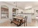 Cozy dining area with rustic table and chairs, connecting the kitchen and living spaces at 1350 S Greenfield Rd # 1123, Mesa, AZ 85206