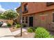 Welcoming front entrance with well-maintained landscaping and desert flora, set in a peaceful neighborhood at 1350 S Greenfield Rd # 1123, Mesa, AZ 85206