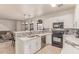 Bright kitchen boasts white cabinets, stainless steel appliances, and stylish backsplash at 1350 S Greenfield Rd # 1123, Mesa, AZ 85206