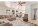 Inviting living room and dining area with a comfortable sofa and natural light at 1350 S Greenfield Rd # 1123, Mesa, AZ 85206