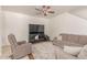 Comfortable living room featuring plush seating, a ceiling fan, and a contemporary media console at 1350 S Greenfield Rd # 1123, Mesa, AZ 85206