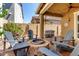 Cozy backyard with a stone fire pit surrounded by comfortable Adirondack chairs, perfect for gatherings at 1528 N Balboa --, Mesa, AZ 85205