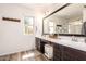Bathroom with double sink vanity with modern fixtures and a large mirror above at 1528 N Balboa --, Mesa, AZ 85205