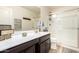 Bathroom featuring dark wood cabinetry with a white countertop and clear glass shower at 1528 N Balboa --, Mesa, AZ 85205