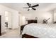 Bright bedroom with a ceiling fan, neutral walls, carpet, and access to the Primary bathroom at 1528 N Balboa --, Mesa, AZ 85205