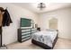 Bright bedroom features a modern bed and ample storage with a mounted tv at 1528 N Balboa --, Mesa, AZ 85205