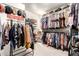 Walk-in closet with ample storage including hanging racks and shelves for clothes and accessories at 1528 N Balboa --, Mesa, AZ 85205