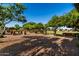 Beautiful community park with lush trees, walking paths, benches, and inviting common areas for residents at 1528 N Balboa --, Mesa, AZ 85205