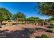 Picturesque community park featuring mature trees, walking paths, benches, and meticulously maintained landscaping at 1528 N Balboa --, Mesa, AZ 85205