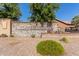 Stone 'Copper Crest' sign with landscaping and brick accents offers a welcoming entrance to the neighborhood at 1528 N Balboa --, Mesa, AZ 85205
