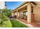 Relaxing covered patio with outdoor seating, string lights, ceiling fan, and built-in bar area at 1528 N Balboa --, Mesa, AZ 85205