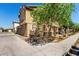 Home exterior featuring low-maintenance landscaping, sidewalk, and a well-maintained lawn at 1528 N Balboa --, Mesa, AZ 85205