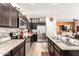 Stylish kitchen with stainless steel appliances, granite countertops, and dark cabinetry at 1528 N Balboa --, Mesa, AZ 85205