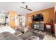 Cozy living room with orange accent wall, stylish furniture, and modern decor at 1528 N Balboa --, Mesa, AZ 85205