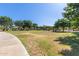 Community park with grassy area, walking path, trees, and shade structures for relaxing in the outdoors at 1528 N Balboa --, Mesa, AZ 85205