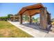 Community pavilion featuring picnic tables and ample seating for outdoor gatherings in a park-like setting with lush green lawns at 1528 N Balboa --, Mesa, AZ 85205