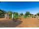 Fun playground with climbing structures and play equipment surrounded by safety surfacing and landscaping at 1528 N Balboa --, Mesa, AZ 85205