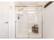 Bathroom shower featuring a clear glass enclosure, tiled walls, and modern fixtures at 1528 N Balboa --, Mesa, AZ 85205