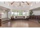 Open floor plan featuring natural light, custom seating, and beams at 1545 E Christy Dr, Phoenix, AZ 85020