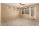 Neutral bedroom with a ceiling fan, carpet and lots of natural light at 1612 W Lacewood Pl, Phoenix, AZ 85045