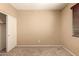 This bedroom offers a large closet and a window, making it cozy and functional at 1612 W Lacewood Pl, Phoenix, AZ 85045