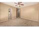 Neutral bedroom with a ceiling fan, carpet and lots of natural light at 1612 W Lacewood Pl, Phoenix, AZ 85045