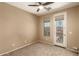 Neutral bedroom with a ceiling fan, carpet and a balcony view at 1612 W Lacewood Pl, Phoenix, AZ 85045