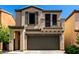 Charming two-story home featuring stucco exterior and a cozy second-floor balcony at 1612 W Lacewood Pl, Phoenix, AZ 85045