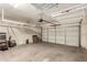 Spacious garage featuring ample storage with shelving at 1612 W Lacewood Pl, Phoenix, AZ 85045