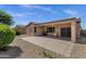 Relaxing backyard featuring covered patio area, perfect for outdoor dining and entertaining at 16525 W Tranquility Ln, Surprise, AZ 85387