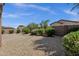 Backyard showcasing desert landscaping and block wall at 16525 W Tranquility Ln, Surprise, AZ 85387