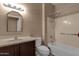 Cozy bathroom featuring a vanity sink, toilet, and tub with shower at 16525 W Tranquility Ln, Surprise, AZ 85387