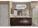 Bathroom featuring a double vanity with a full mirror and a glass-enclosed shower at 16525 W Tranquility Ln, Surprise, AZ 85387