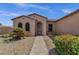 Charming home with arched entry and low-maintenance desert landscaping at 16525 W Tranquility Ln, Surprise, AZ 85387