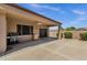 Covered patio with a ceiling fan, grill, and view of the fenced-in backyard at 16525 W Tranquility Ln, Surprise, AZ 85387