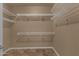 Walk-in closet offering ample storage with wire shelving and neutral walls at 16525 W Tranquility Ln, Surprise, AZ 85387