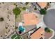 Overhead aerial view of a home with a backyard pool, desert landscaping, and neighboring residential properties at 1672 W Butler Dr, Chandler, AZ 85224