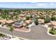 A residential neighborhood showcases well-maintained homes with private pools and desert landscaping under a sunny sky at 1672 W Butler Dr, Chandler, AZ 85224
