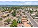 Wide aerial shot showcasing the community's single-Gathering homes, desert landscaping, and tranquil, tree-lined streets at 1672 W Butler Dr, Chandler, AZ 85224