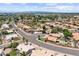 An aerial view of a suburban neighborhood featuring single-Gathering homes with lush landscaping and tree-lined streets at 1672 W Butler Dr, Chandler, AZ 85224